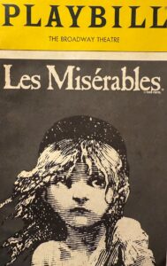 A 1988 Playbill from The Broadway Theatre for Les Misérables, featuring the iconic illustration of young Cosette.